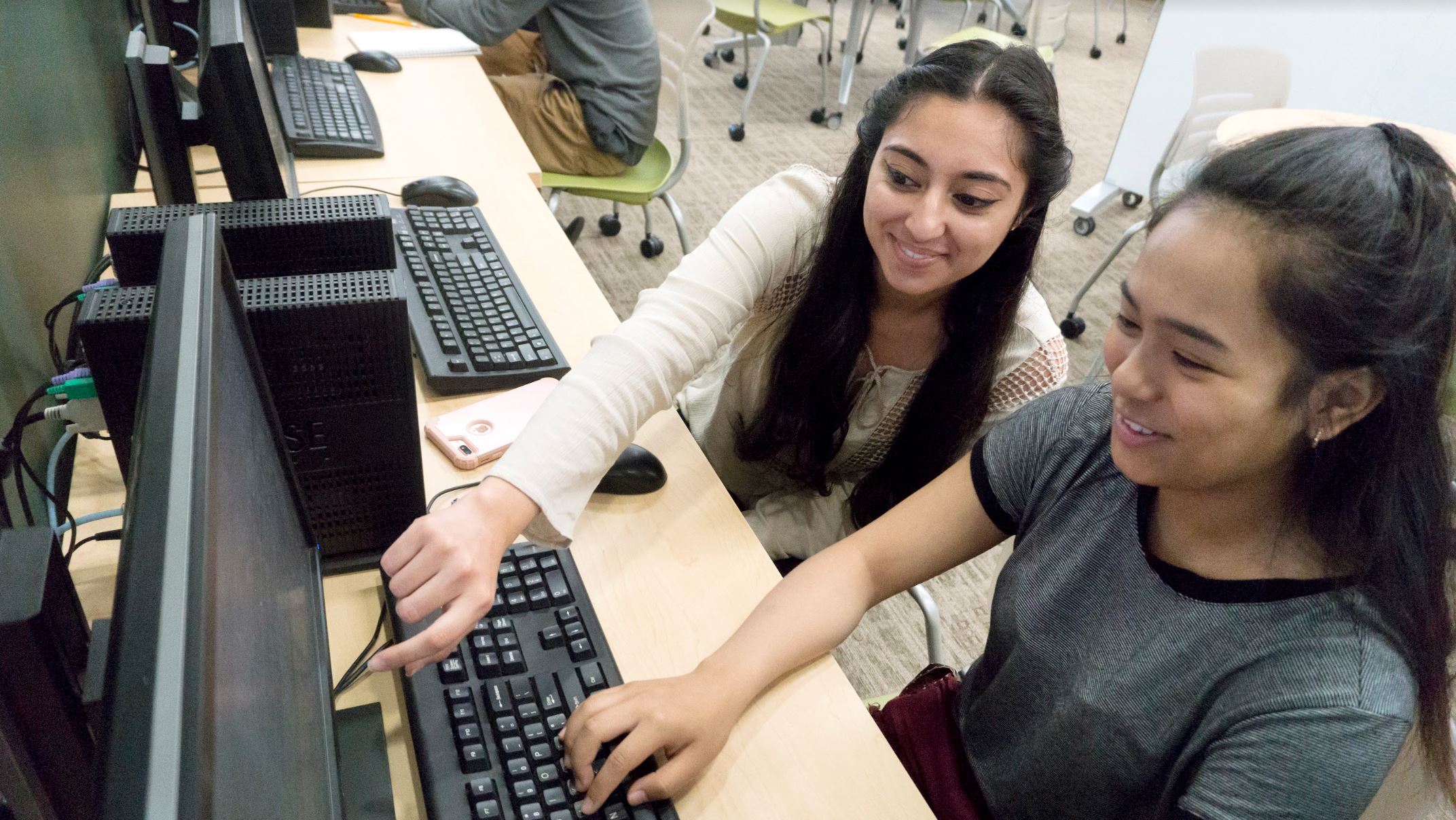 Two students working at a computer
