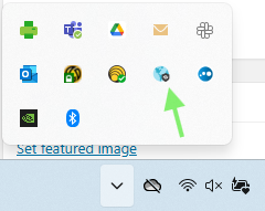 Windows desktop system tray found on bottom right of screen, with a green arrow pointing to the globe icon for Global Protect application. Icon is blue, indicating it is Connected.